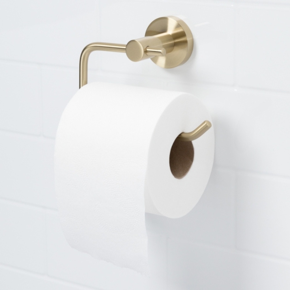 Lifestyle image of the Bristan Round Brushed Brass Toilet Roll Holder with toilet roll